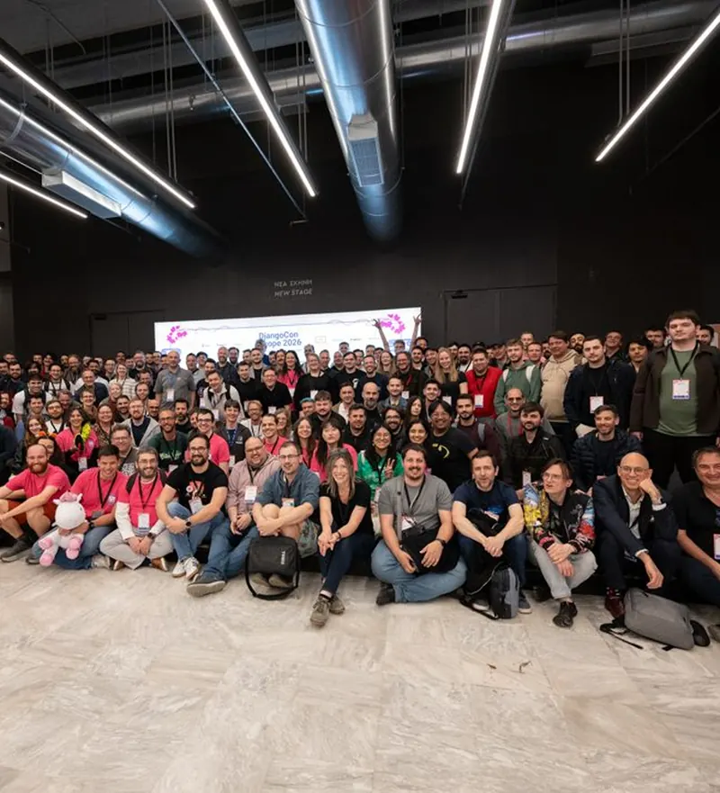 DjangoCon Europe 2026 Athens group photo in the conference hall